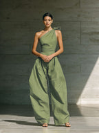 Women's loose sleeveless off-shoulder wide-leg jumpsuit from Plush Fashion Hub, featuring a belted waist and casual style.