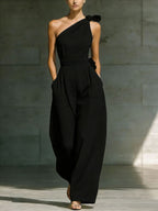 Women's loose sleeveless off-shoulder wide-leg jumpsuit from Plush Fashion Hub, featuring a belt and casual summer style.