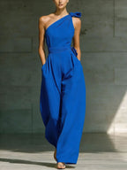 Women's loose sleeveless off-shoulder belted wide-leg jumpsuit in casualwear style, featuring a relaxed fit and stylish design.