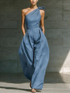 Women's loose sleeveless off-shoulder belted wide-leg jumpsuit in casualwear style, featuring a relaxed fit and wide-leg design.