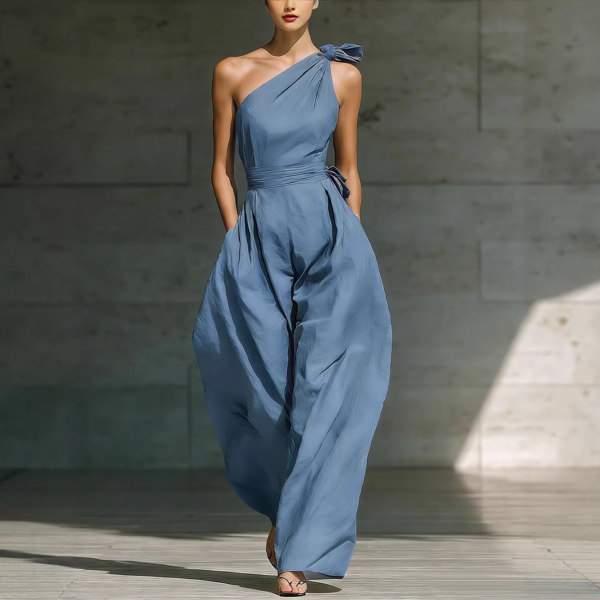 Women’s loose sleeveless off-shoulder belted wide-leg jumpsuit in casualwear style, featuring a relaxed fit and stylish design.