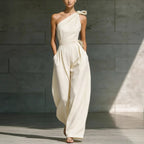 Women's loose sleeveless off-shoulder jumpsuit with a belted waist and wide-leg design, perfect for casualwear by Plush Fashion Hub.