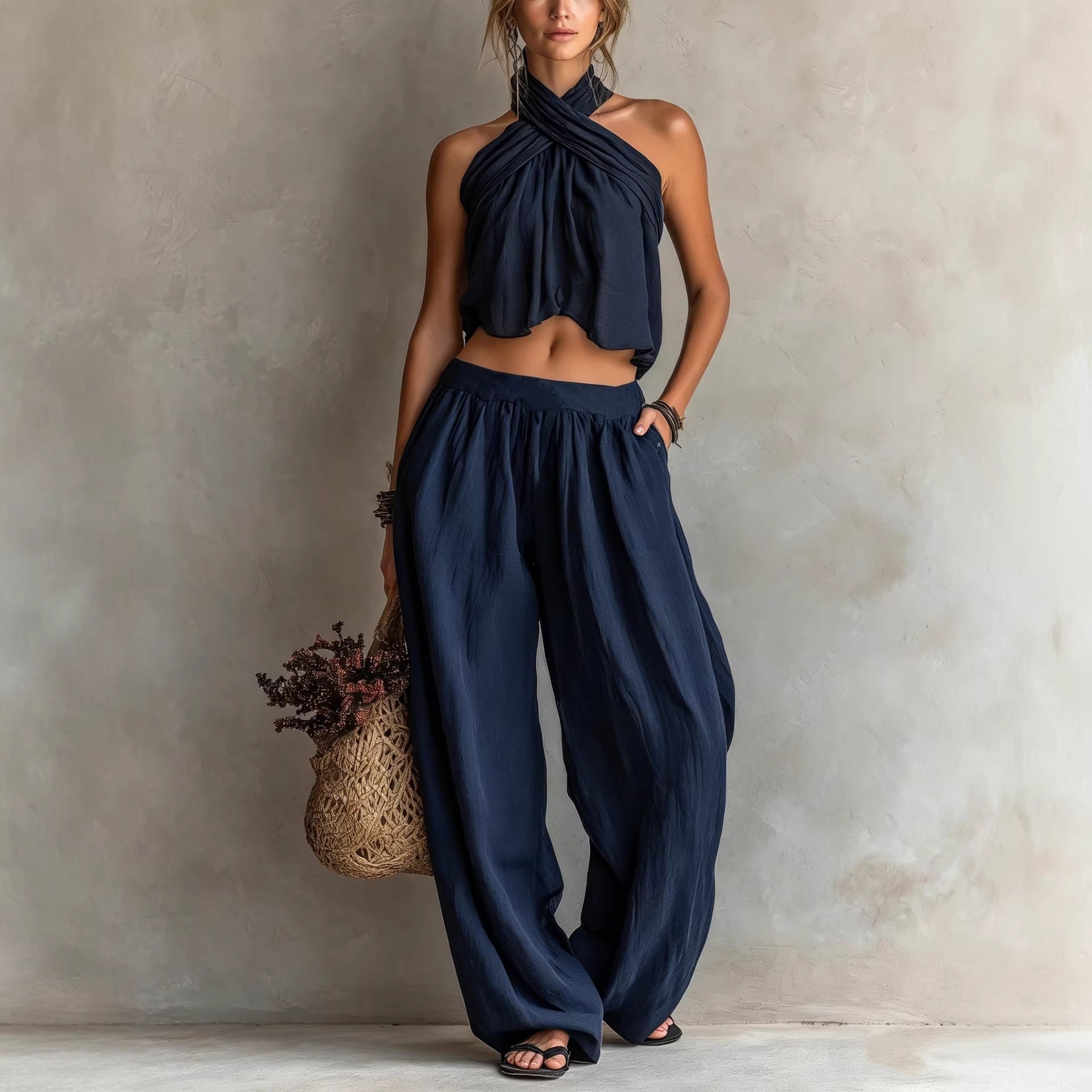 Women's loose sleeveless linen blend top and wide-leg pants set, casualwear by Plush Fashion Hub, shown on a model.