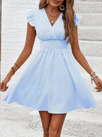 Women's striped V-neck mini dress with flutter sleeves, casual summer dress by Plush Fashion Hub, perfect for warm weather.