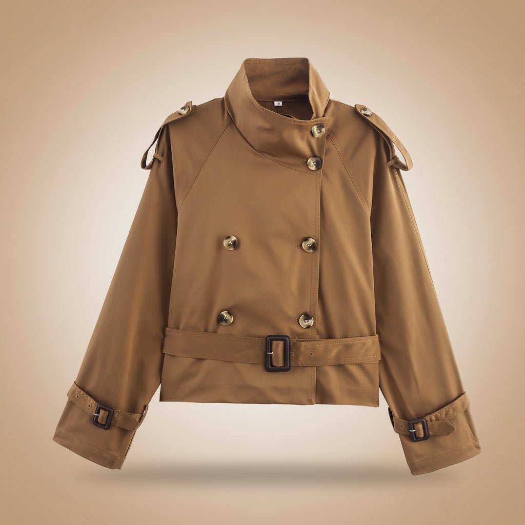 Women's short trench coat with notch collar and belt buckle detail, stylish jacket from Plush Fashion Hub.