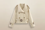 Women's short trench coat with notch collar and belt buckle detail, stylish jacket by Plush Fashion Hub.