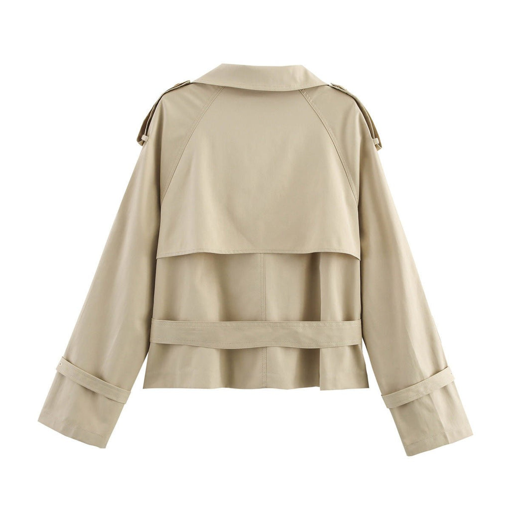 Women’s short trench coat with notch collar and belt buckle detail from Plush Fashion Hub, stylish jacket for casual or formal wear.