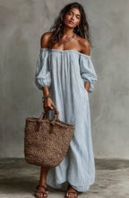 Women's off-shoulder long-sleeve maxi dress by Plush Fashion Hub, casualwear with flowing fabric and elegant off-the-shoulder design.