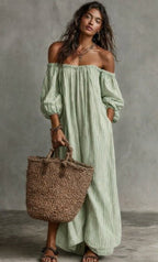 Women's off-shoulder long-sleeve maxi dress by Plush Fashion Hub, casualwear with flowing fabric and elegant neckline.