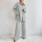 Women's pleated long sleeve lapel two-piece set with loose top and pants, casualwear by Plush Fashion Hub.