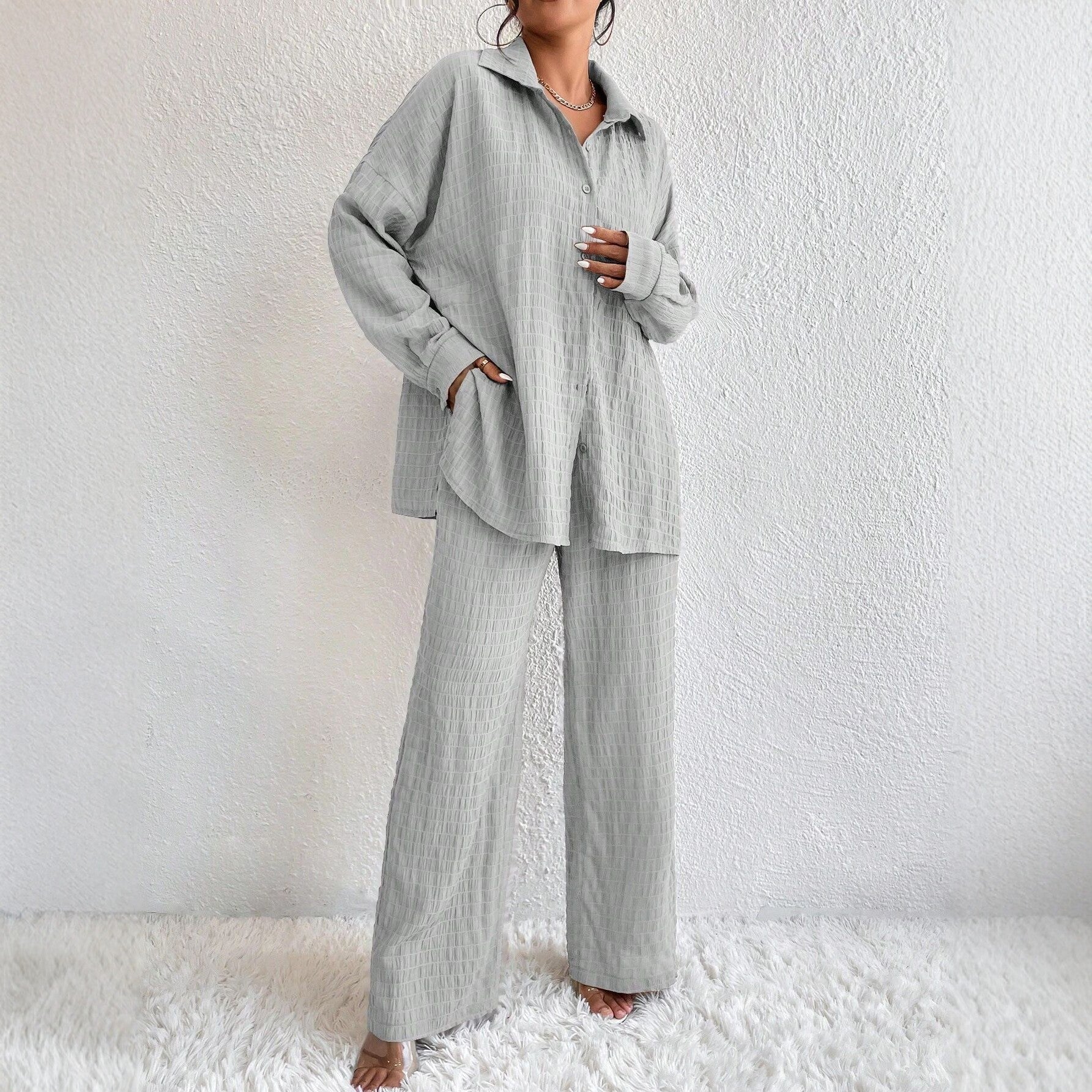 Women's pleated long sleeve lapel two-piece set with loose top and pants, casualwear by Plush Fashion Hub.