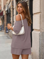 Plus size women's boat neck T-shirt and shorts lounge set by Trendsi, casual and comfortable clothing set for relaxed wear.