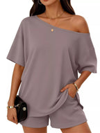 Plus size women's boat neck T-shirt and shorts lounge set by Trendsi, comfortable casual clothing for relaxed wear.