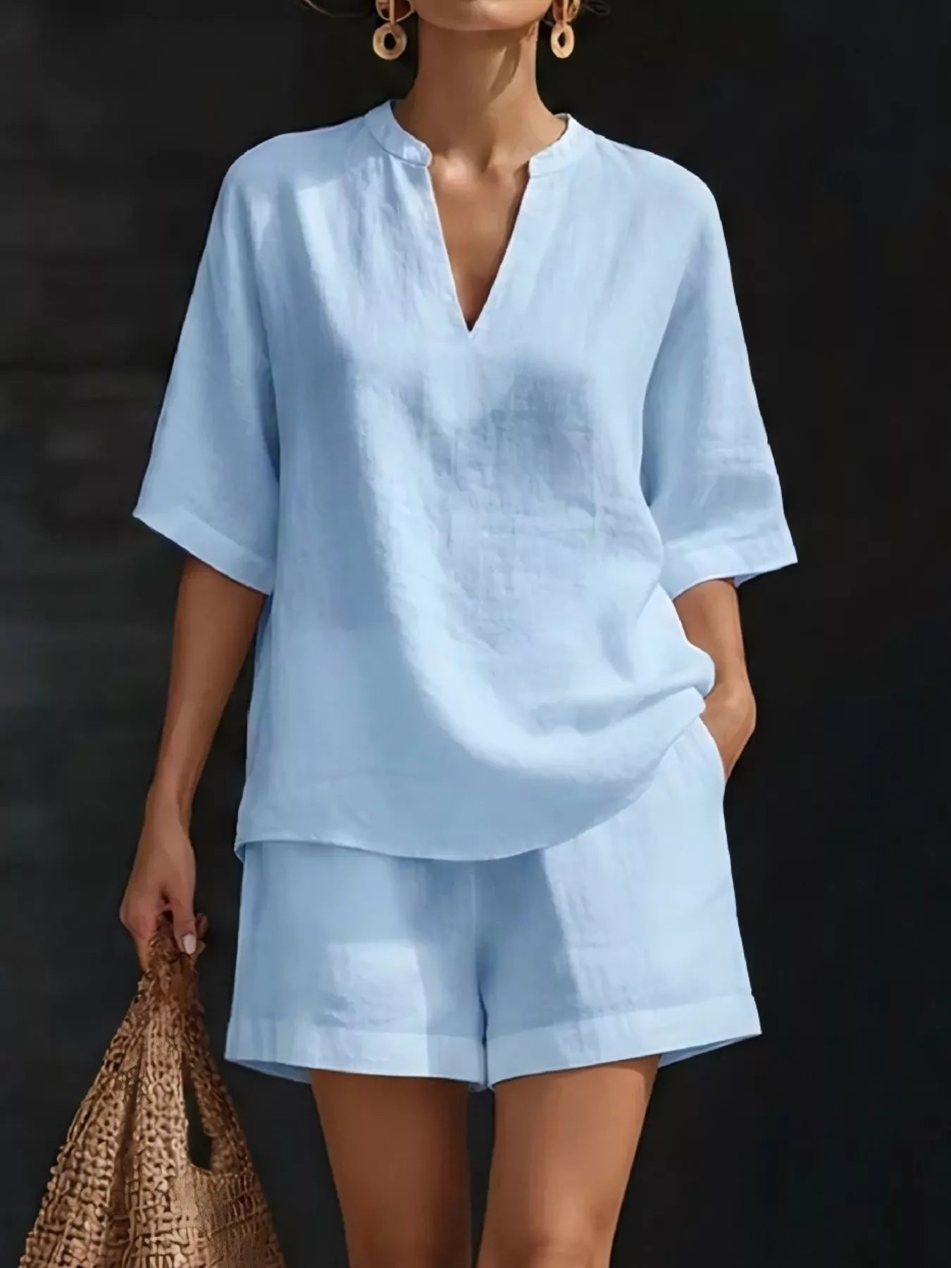 Plus size women's lounge set featuring a notched collar half sleeve top and matching shorts, comfortable and stylish for relaxed wear.