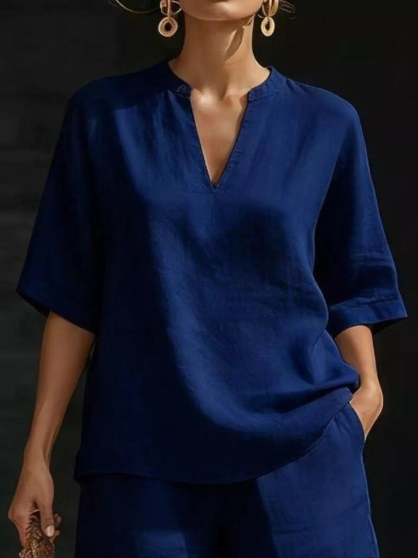 Plus size women's lounge set with notched collar half sleeve top and matching shorts, comfortable and stylish for relaxed wear.