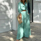 Plus size women's wide-leg elegant pant set in casualwear style, featuring comfortable, flowing fabric and stylish design.