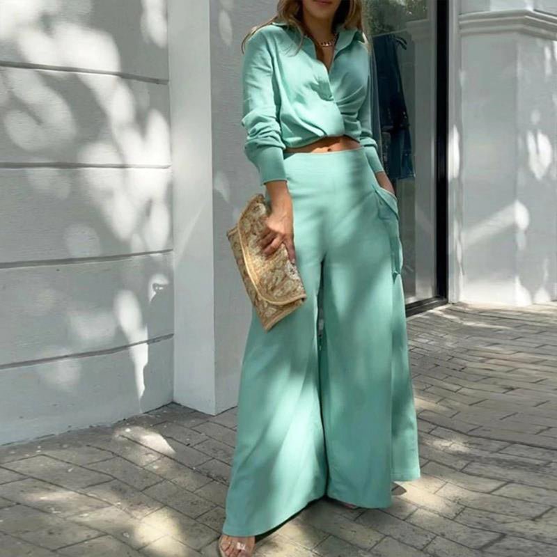 Plus size women's wide-leg elegant pant set in casualwear style, featuring comfortable, flowing fabric and stylish design.