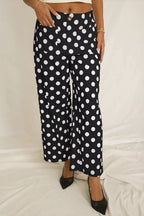 Women's polka dot straight-leg pants with pockets by Plush Fashion Hub, showing the stylish pattern and comfortable fit.