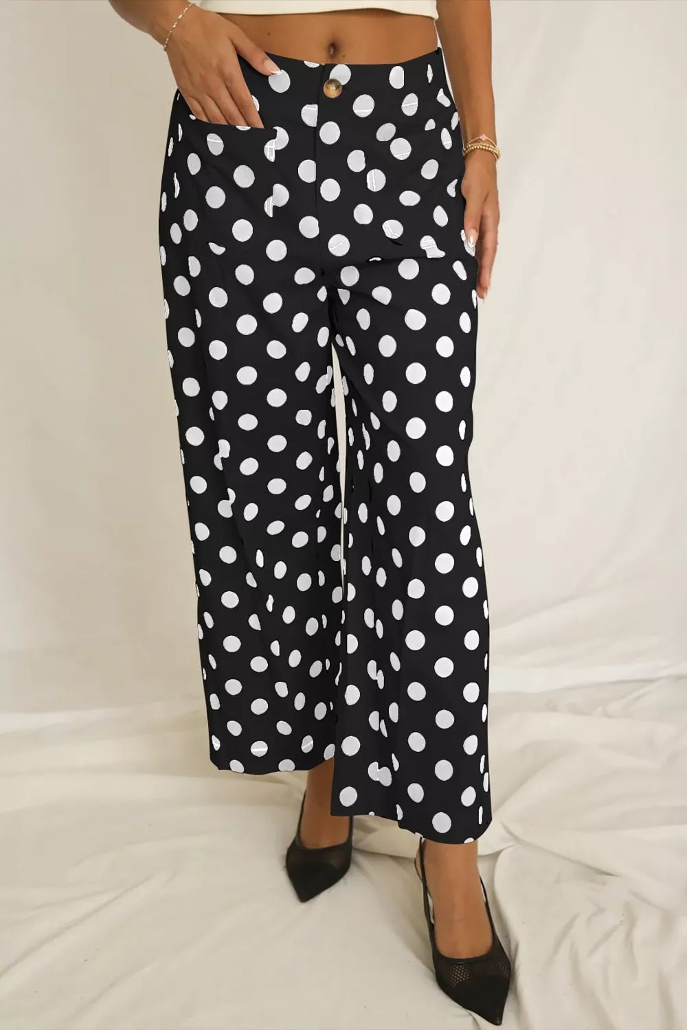 Women's polka dot straight-leg pants with pockets by Plush Fashion Hub, showing the stylish pattern and comfortable fit.