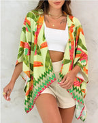 Women’s printed cardigan top with drop shoulder sleeves, casualwear from Plush Fashion Hub, shown hanging on a hanger.
