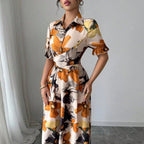 Women’s printed puff sleeve dress with blouse collar and cross-tie waist, casualwear by Plush Fashion Hub.