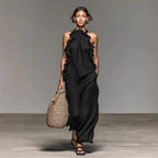 Women's ruffled halterneck sleeveless open-back maxi dress by Plush Fashion Hub, perfect for resort casualwear, shown on a model.