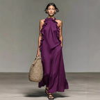 Women's ruffled halterneck sleeveless open-back maxi dress by Plush Fashion Hub, perfect for casual resort wear.