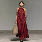 Women's ruffled halterneck sleeveless open-back maxi dress by Plush Fashion Hub, perfect for casual resort wear.
