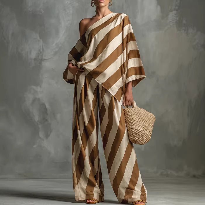 Women’s retro striped batwing top and wide-leg pants set, vintage casualwear by Plush Fashion Hub, featuring bold stripes and relaxed fit.