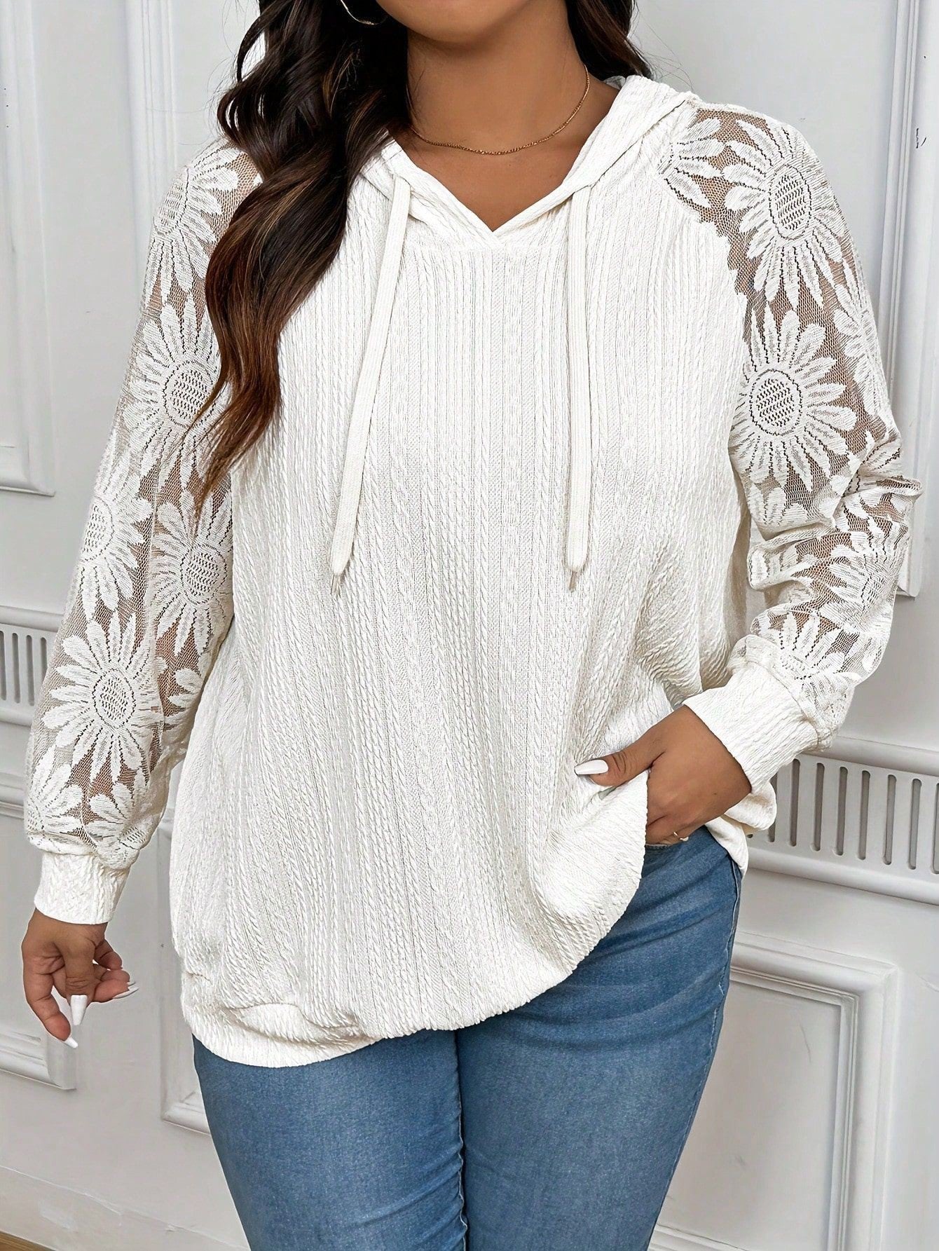 White women's long sleeve hoodie with lace paneling and hollow-out design, featuring a round neckline by Plush Fashion Hub.