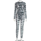 Women's round neck hollowed-out bustier jumpsuit with high-waisted pants, stylish and modern from Plush Fashion Hub.