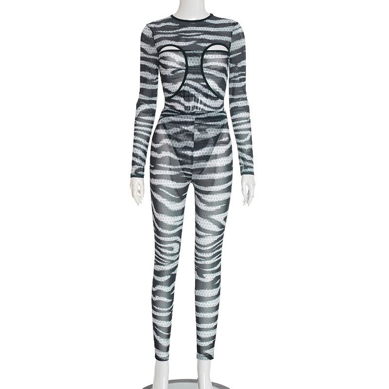 Women's round neck hollowed-out bustier jumpsuit with high-waisted pants, stylish and modern from Plush Fashion Hub.