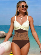 Women's ruffled color block one-piece swimsuit by Trendsi, featuring stylish design and vibrant beachwear for sunny days.