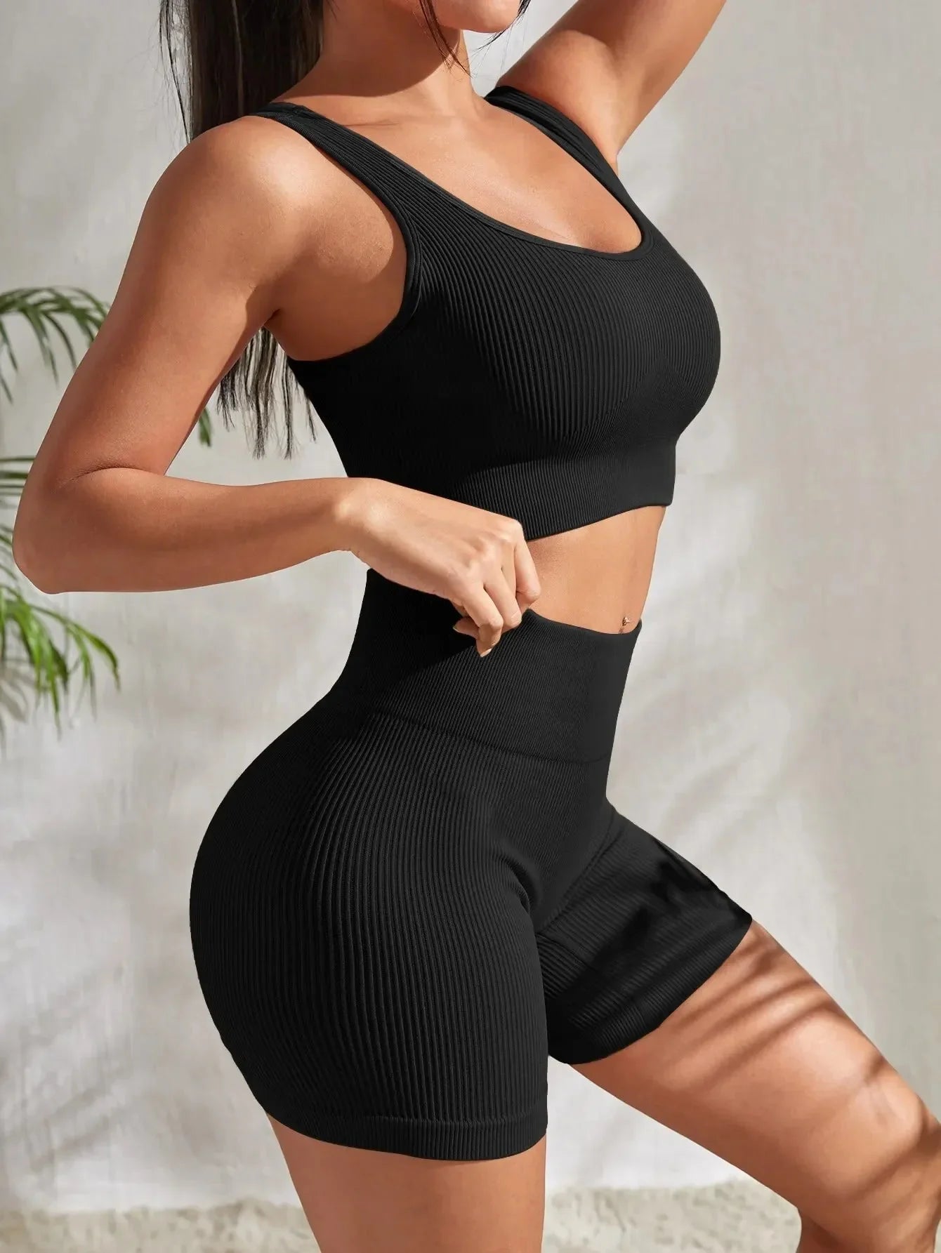 Women's seamless ribbed yoga set by Plush Fashion Hub featuring a fitted athletic top and matching high-waisted leggings.