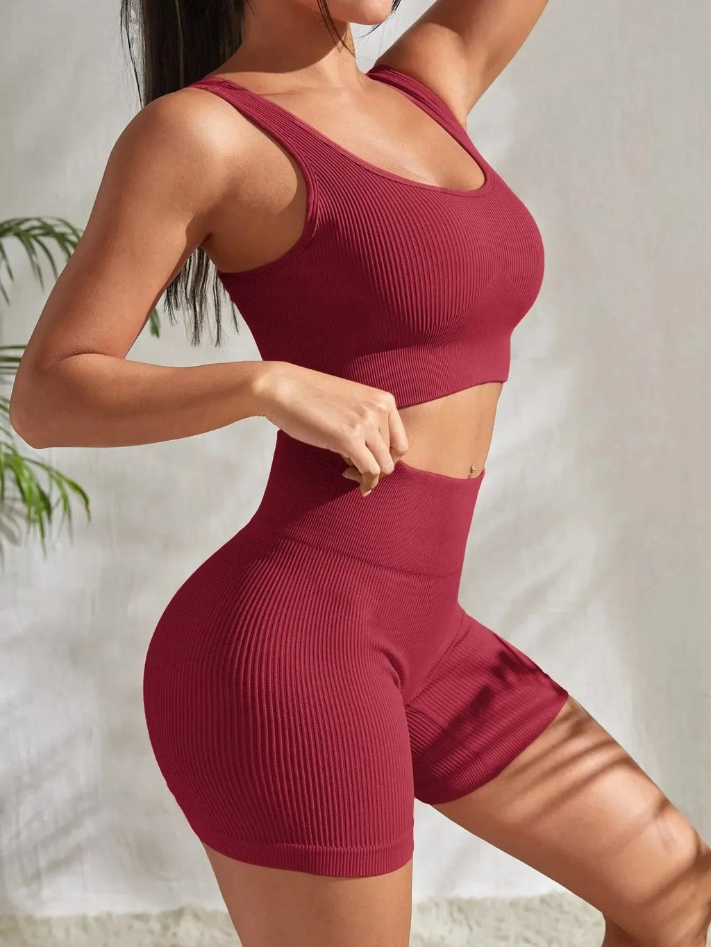 Women’s seamless ribbed yoga set in soft, stretchy fabric featuring a fitted top and high-waisted leggings from Plush Fashion Hub.