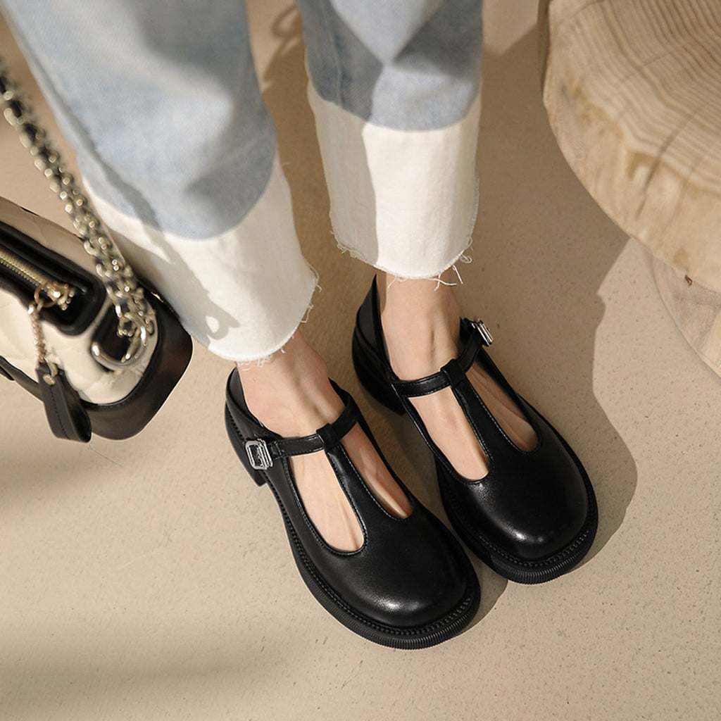 Women’s shallow-mouth Mary Jane shoes by Plush Fashion Hub, featuring classic black footwear with rounded toe and strap detail.