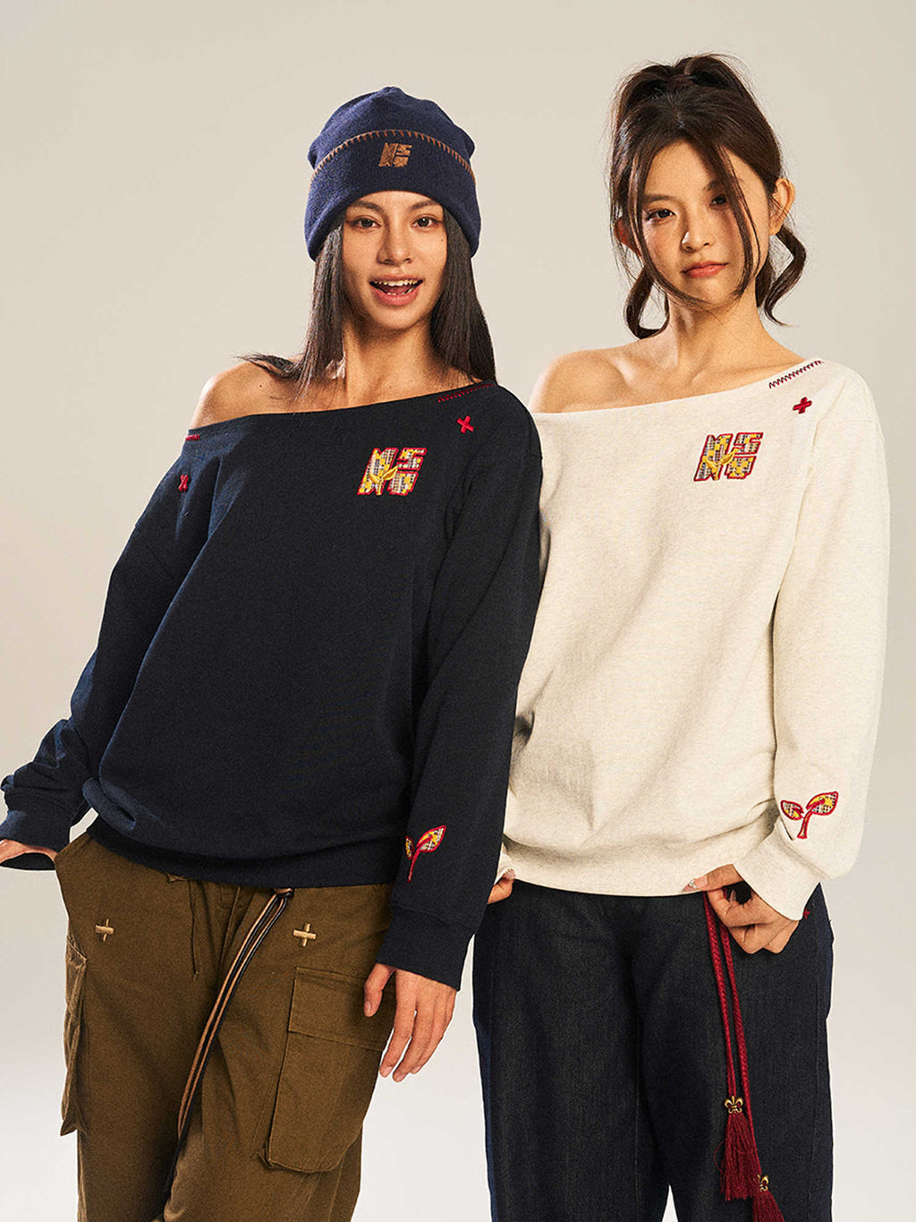 Women’s slanted shoulder embroidered long-sleeve casual top by Plush Fashion Hub, featuring intricate embroidery and a stylish design.
