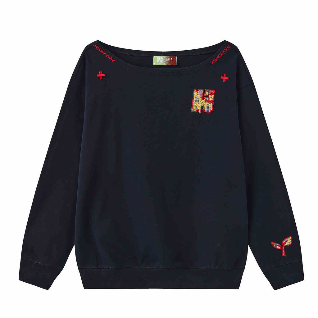 Women’s slanted shoulder embroidered long-sleeve casual top by Plush Fashion Hub, featuring intricate embroidery and a stylish design.