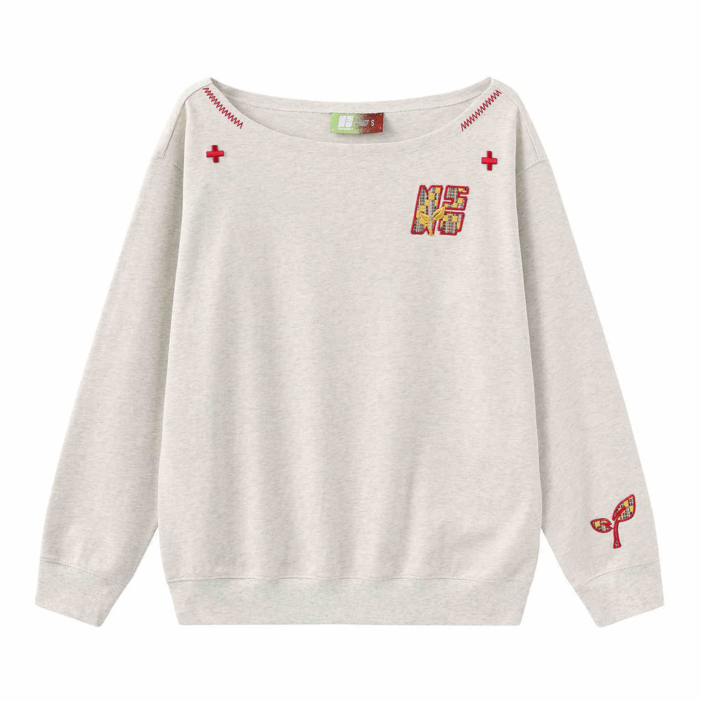 Women’s slanted shoulder embroidered long-sleeve casual top by Plush Fashion Hub, featuring intricate embroidery and a stylish design.