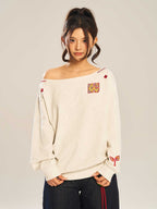 Women’s slanted shoulder embroidered long-sleeve casual top by Plush Fashion Hub showing intricate embroidery and stylish shoulder design.