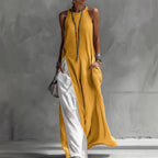 Women’s sleeveless loose contrast color dress with pockets, casualwear by Plush Fashion Hub, showing a relaxed fit and stylish design.