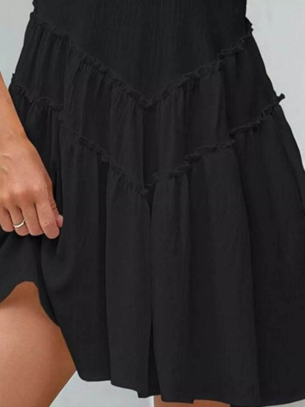 Women's sleeveless round neck mini dress with pockets by Trendsi, featuring a casual fit and stylish design.