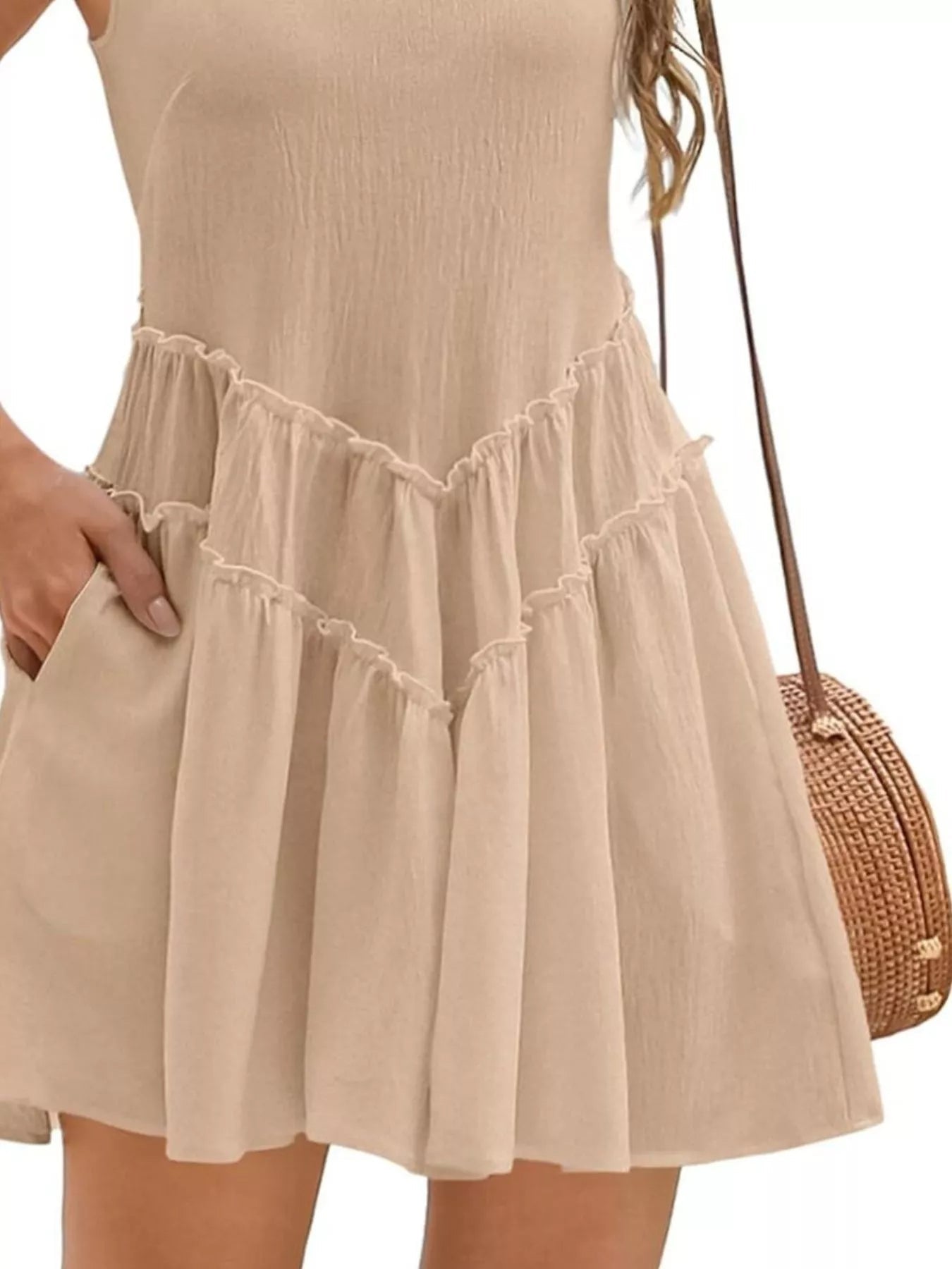 Women's sleeveless round neck mini dress with pockets, stylish and casual, perfect for summer outings, from Trendsi.
