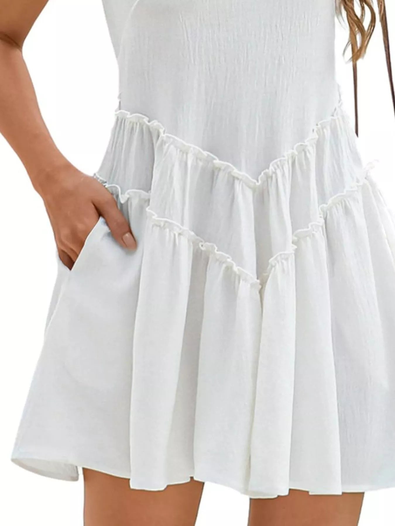 Women's sleeveless round neck mini dress with pockets, stylish and casual, by Trendsi, perfect for warm weather and everyday wear.