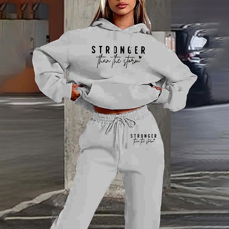 Women's solid 2-piece hoodie set with letter print and front pocket, made by Plush Fashion Hub, casual and comfortable outfit.