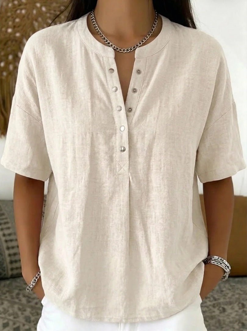 Women’s solid color loose-fit short-sleeve pullover top by Plush Fashion Hub, casualwear style, displayed on a model.