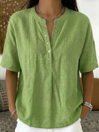 Women's solid color loose-fit short-sleeve pullover top from Plush Fashion Hub, casualwear with a relaxed fit and simple design.