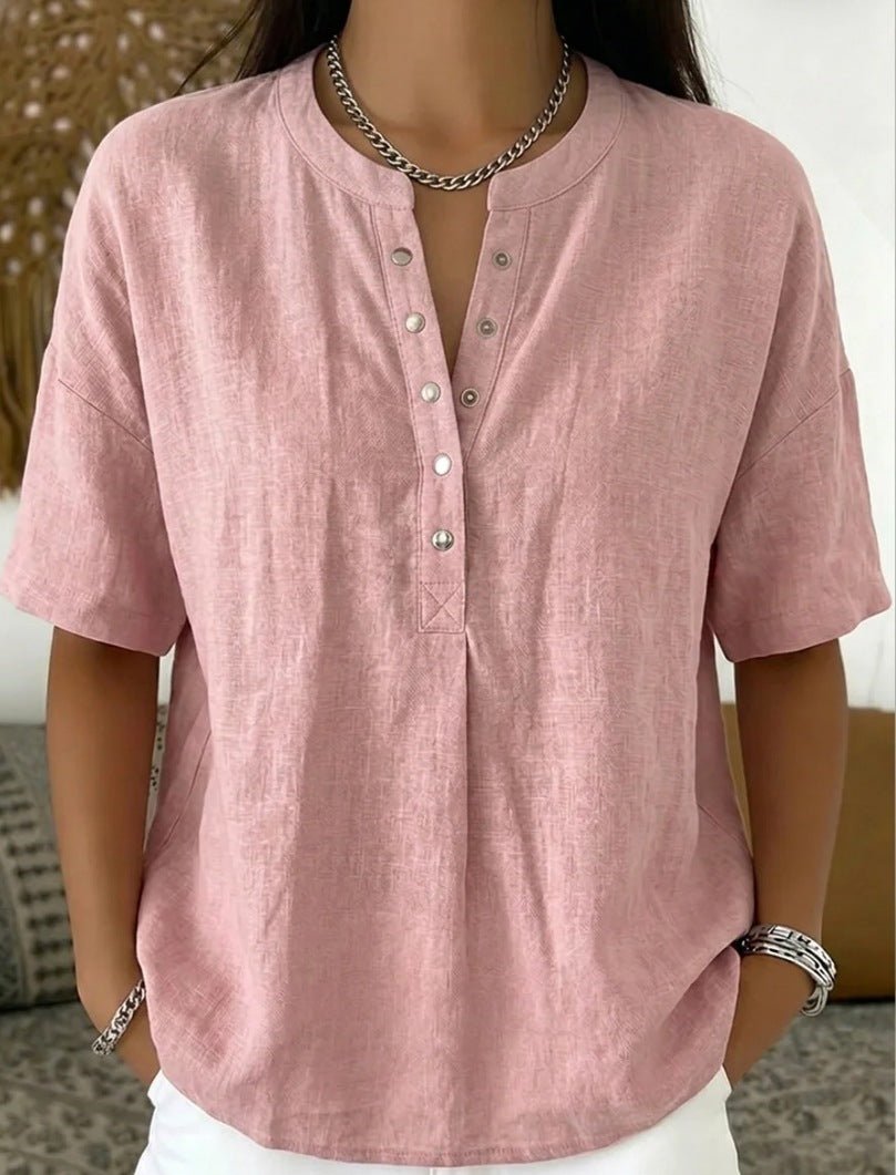 Women's solid color loose-fit short-sleeve pullover top, casualwear by Plush Fashion Hub, displayed on a model.