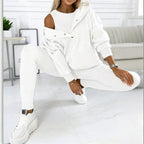 Women’s solid color three-piece casualwear set by Plush Fashion Hub, includes top, pants, and jacket in matching fabric.