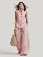 Women's sleeveless stand collar top and high-waist wide-leg pants set by Plush Fashion Hub, casualwear style, shown on model.